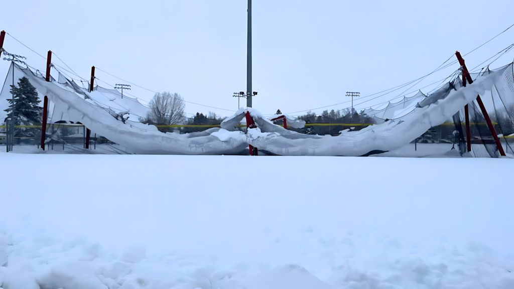 A Backyard Batting Cage torn down by the winter snow