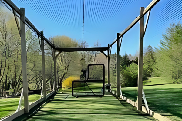A tall and high backyard batting cage
