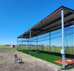 A huge customized backyard batting cage